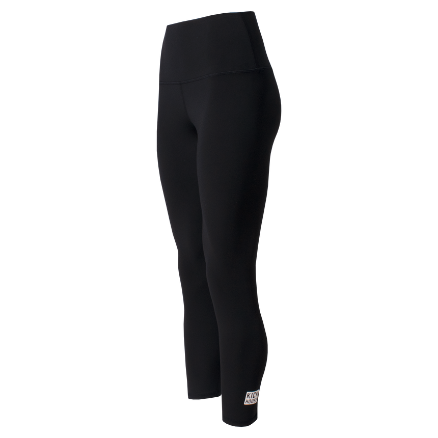 front view of black high waist pure 7/8 leggings with white Kickhouse logo on left ankle
